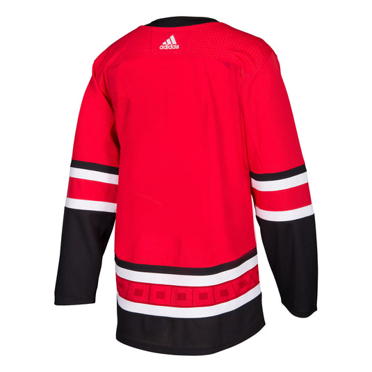 Maillot authentique professionnel domicile des Hurricanes de la Caroline de la LNH